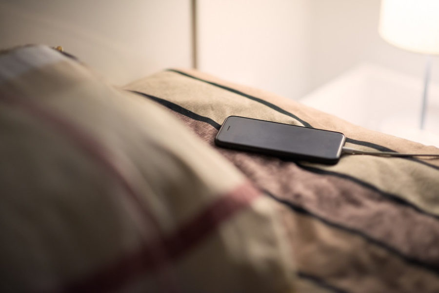 641936 phone charging on the bed 1